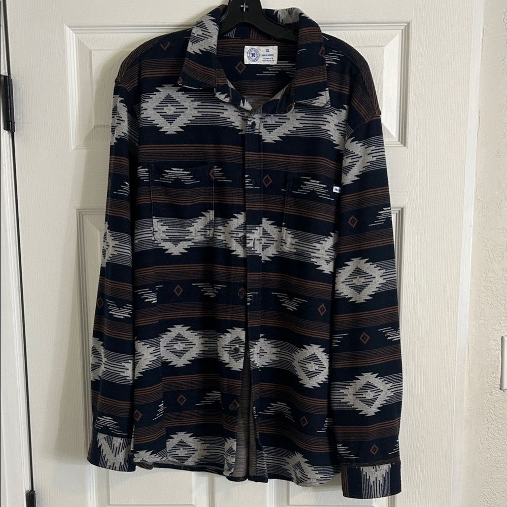 The Hurley Santa Cruz Windchill is a long-sleeved, button-down flannel shirt.